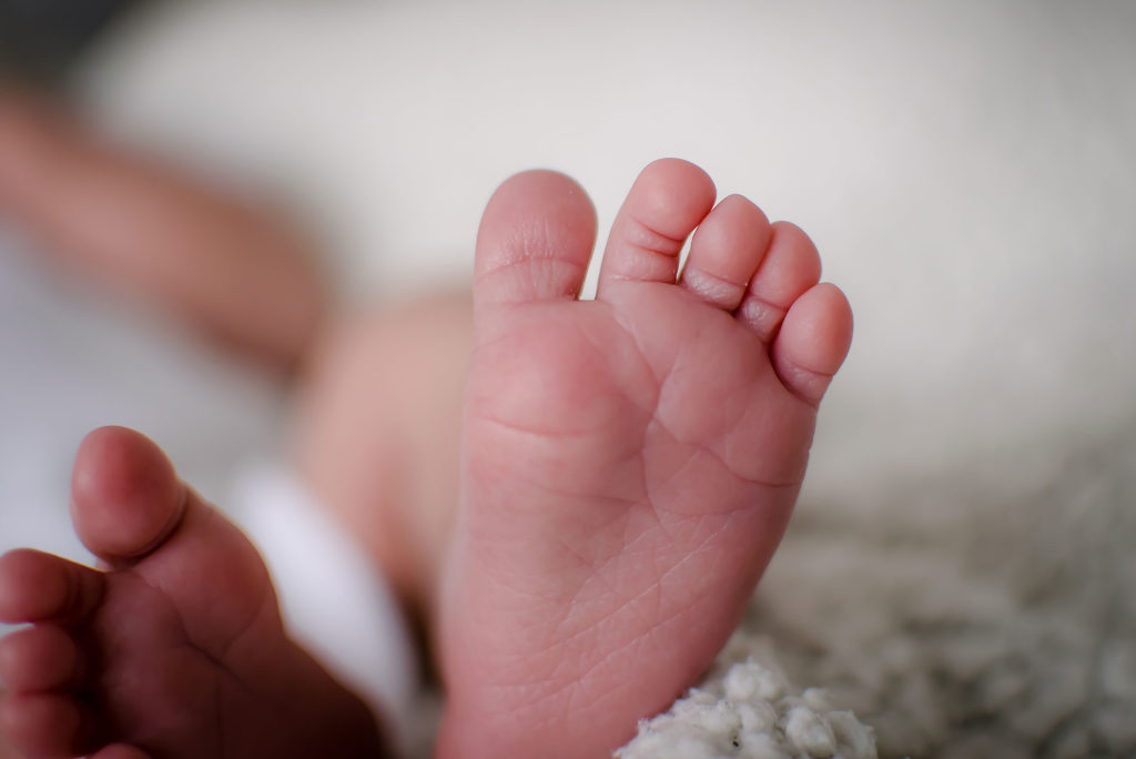 tiny baby foot Newborn Photography Oliver Sussex photographer